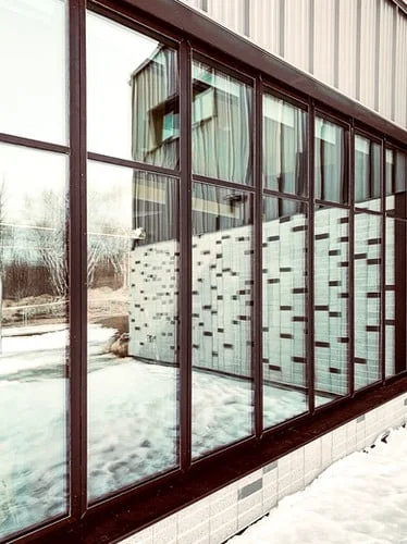 Commercial curtain wall glazed with RockGlass hybrid sealed units across every frame