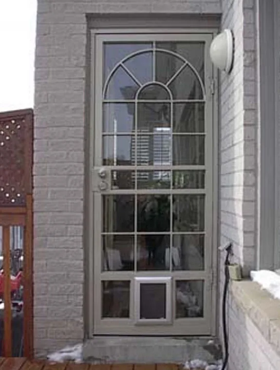 Arched security screen door custom-fitted to a home's arched entryway