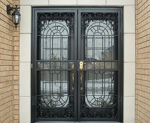 Decorative double security screen doors installed on a residential front entrance