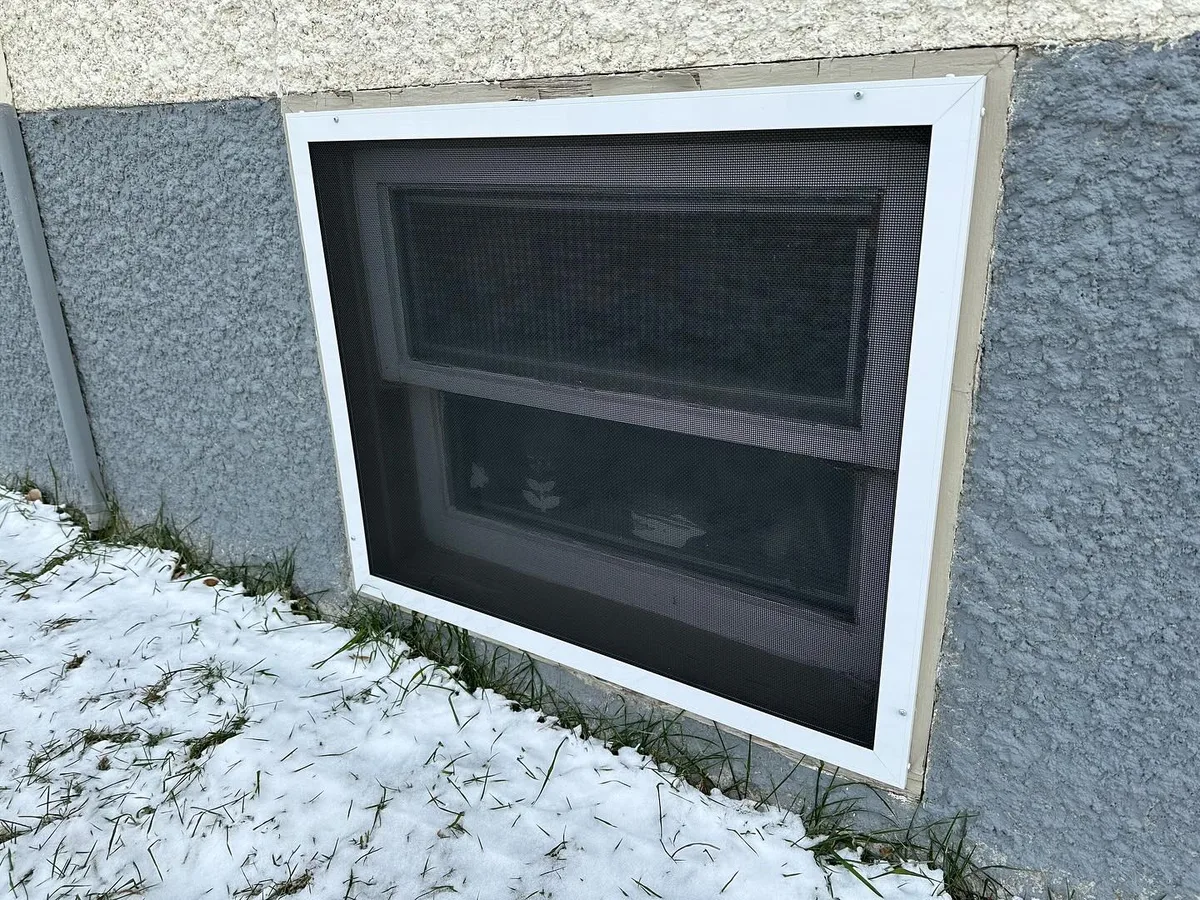 RockScreen stainless steel security screen installed on a business window